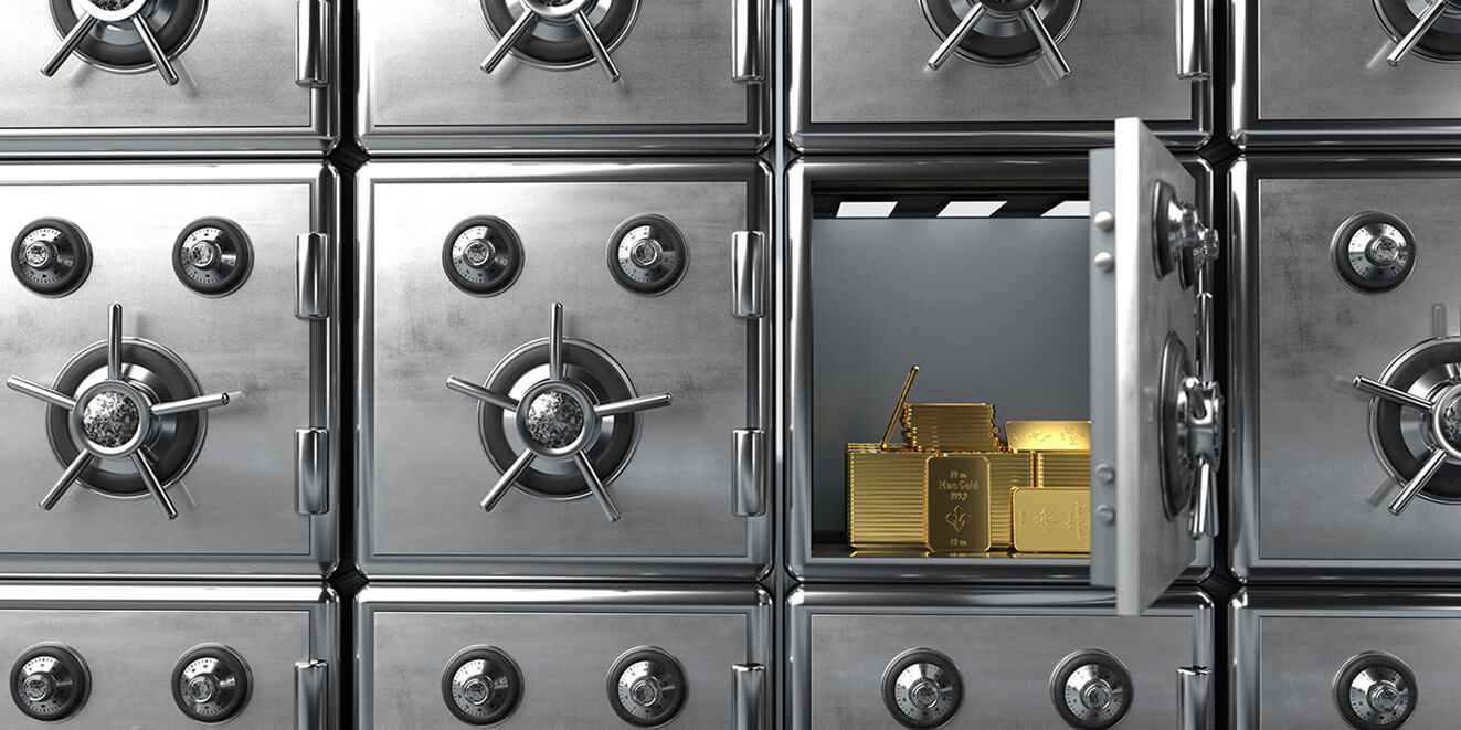 Image of several vaults with gold bars stacked inside one open vault