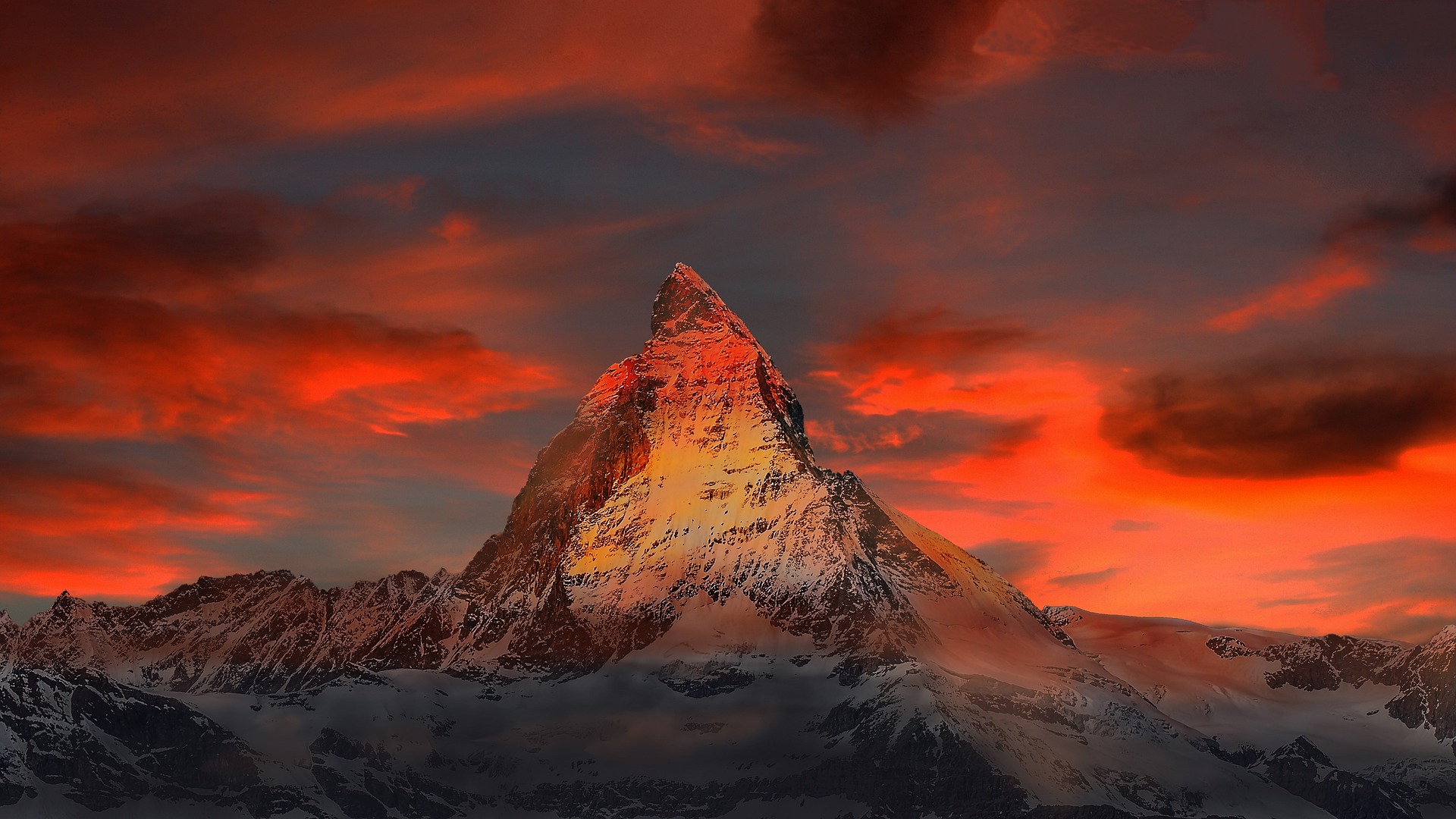 Snowy mountain against an imposing sky